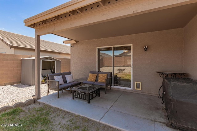 view of patio / terrace with a storage unit, an outdoor structure, fence, and an outdoor hangout area