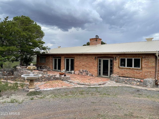 rear view of house featuring a patio area