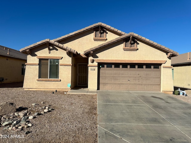 ranch-style home with a garage