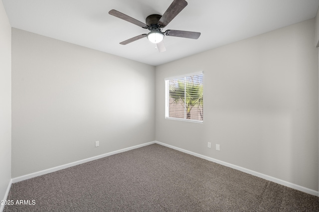 unfurnished room with carpet flooring, ceiling fan, and baseboards