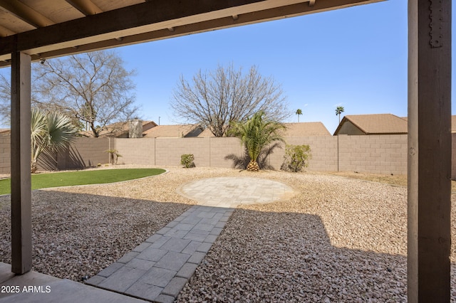 view of yard with a fenced backyard and a patio