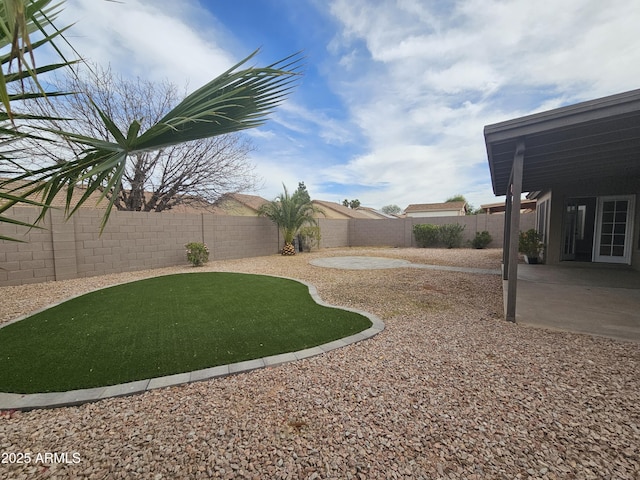 view of yard with a fenced backyard and a patio