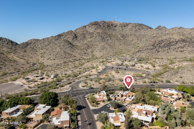 birds eye view of property with a mountain view