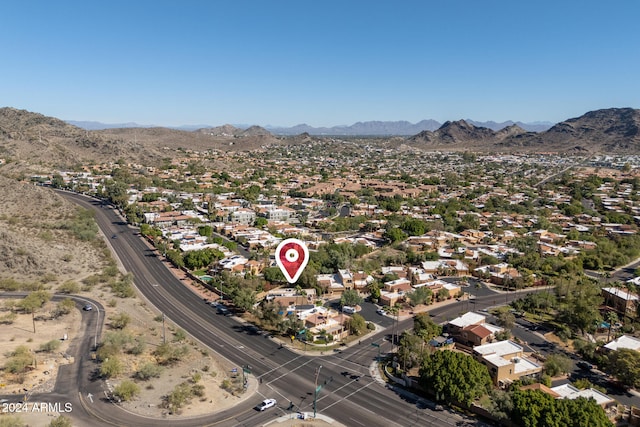 birds eye view of property with a mountain view