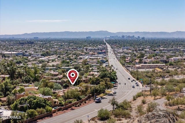 birds eye view of property featuring a mountain view