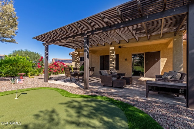 view of patio / terrace with a pergola, ceiling fan, and an outdoor hangout area