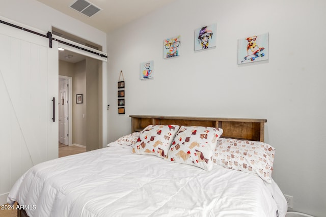 bedroom with a barn door