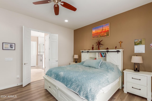 bedroom with light wood-type flooring and ceiling fan