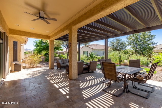 view of patio with outdoor lounge area and ceiling fan