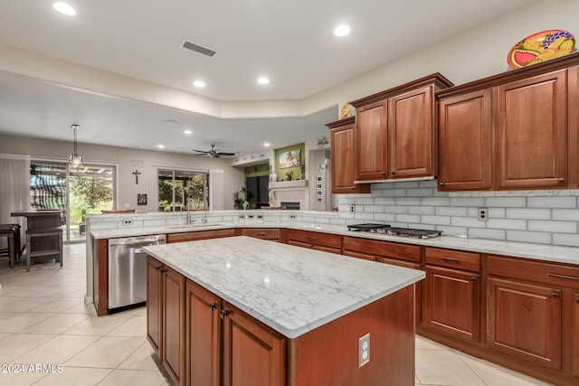 kitchen featuring a center island, stainless steel appliances, and kitchen peninsula