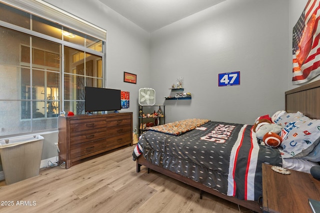 bedroom with light hardwood / wood-style flooring