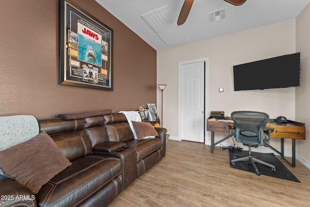 home office featuring light wood-type flooring and ceiling fan