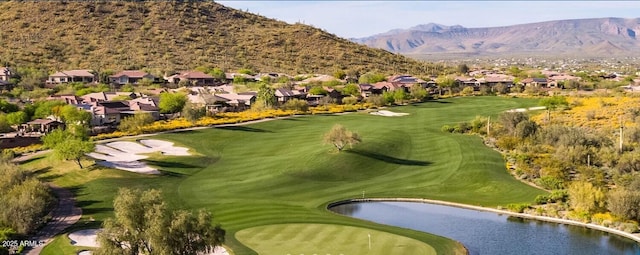 surrounding community featuring a water and mountain view