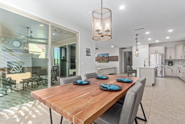 dining area with a chandelier, recessed lighting, visible vents, and light tile patterned flooring