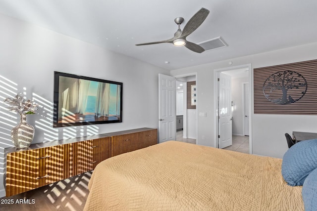 bedroom with ceiling fan and tile patterned flooring