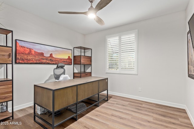 home office with baseboards, a ceiling fan, and wood finished floors