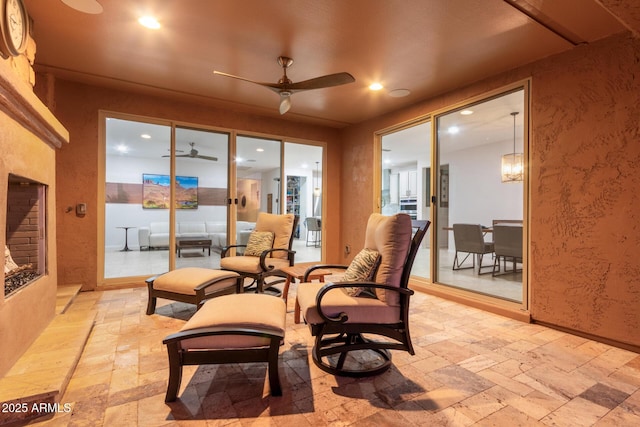 interior space with ceiling fan