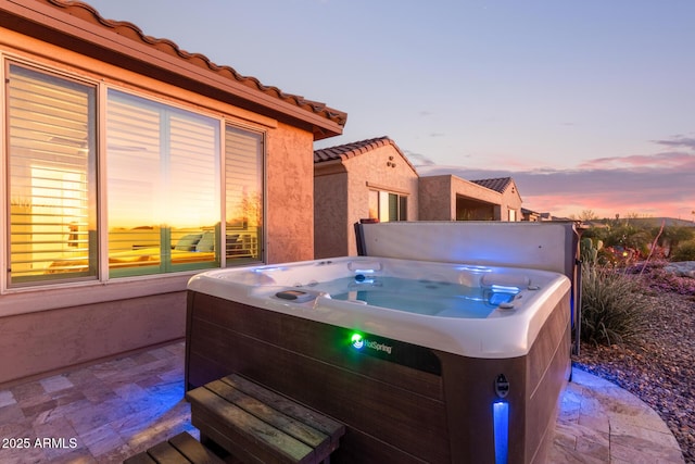 view of patio with a hot tub