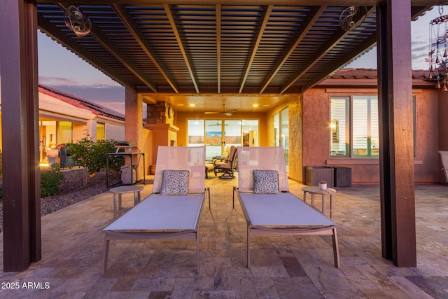 view of patio featuring ceiling fan, an outdoor hangout area, and a pergola