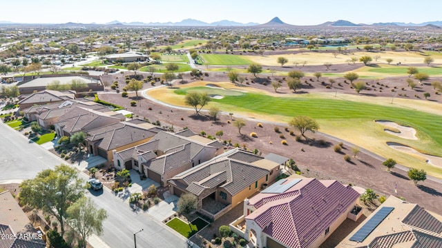 birds eye view of property with a residential view, view of golf course, and a mountain view