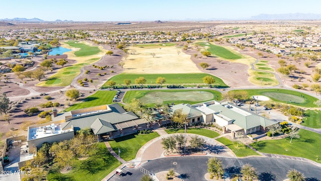 aerial view featuring a mountain view, view of golf course, and a residential view