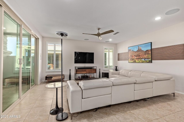 living room with light tile patterned floors, recessed lighting, visible vents, a ceiling fan, and baseboards