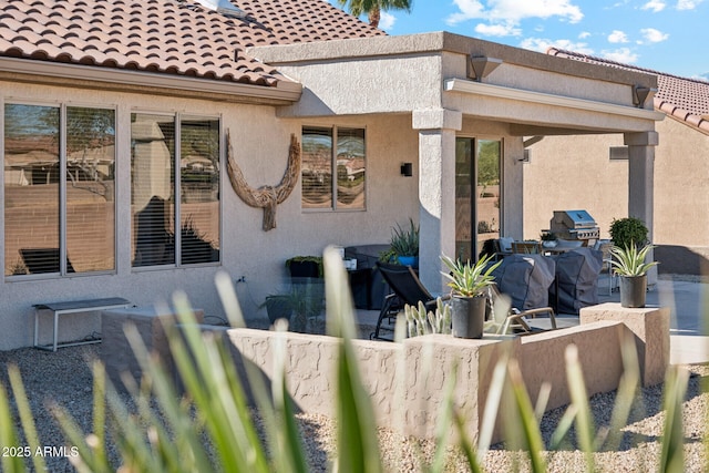 rear view of property with a patio area