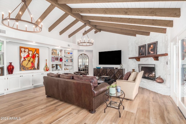 living room featuring high vaulted ceiling, a stone fireplace, light wood-type flooring, beamed ceiling, and a notable chandelier