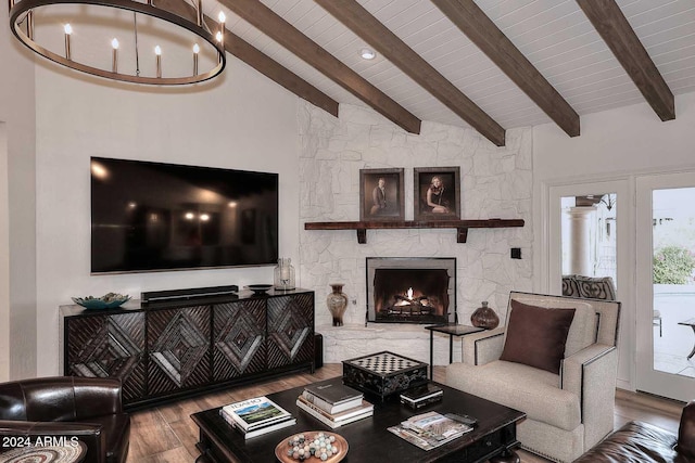 living room with a fireplace, beam ceiling, light hardwood / wood-style floors, and high vaulted ceiling