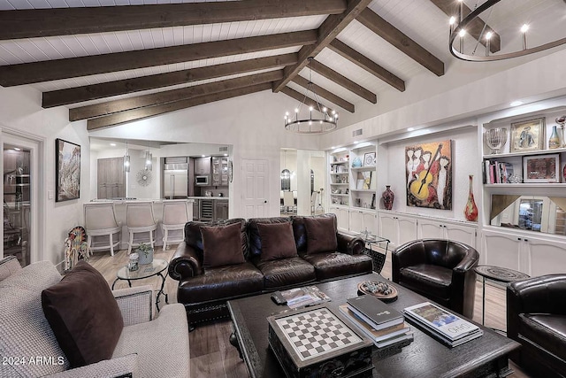 living room with high vaulted ceiling, an inviting chandelier, hardwood / wood-style flooring, built in shelves, and beamed ceiling