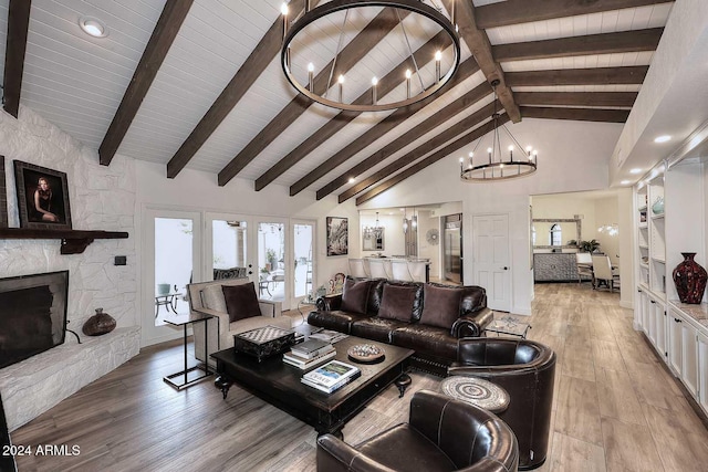 living room with high vaulted ceiling, french doors, beam ceiling, light hardwood / wood-style floors, and a chandelier