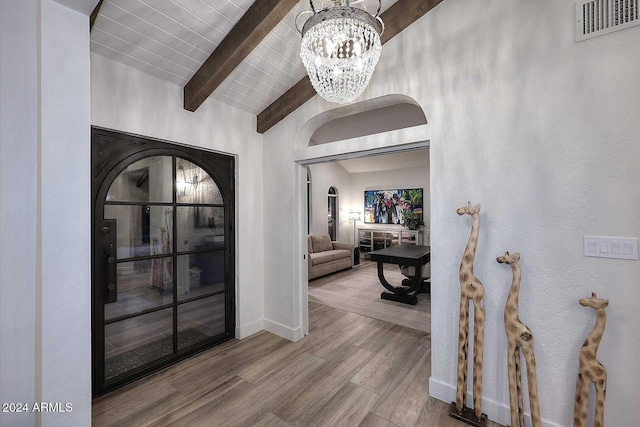 hallway with a chandelier, lofted ceiling with beams, hardwood / wood-style flooring, and wood ceiling