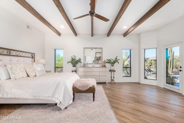 bedroom featuring multiple windows, ceiling fan, light hardwood / wood-style floors, and access to exterior