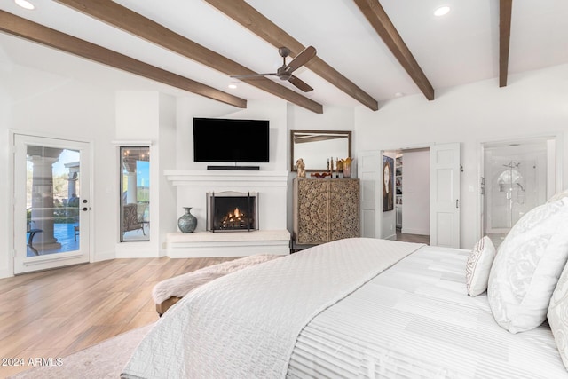 bedroom featuring ceiling fan, beam ceiling, access to exterior, and light hardwood / wood-style flooring