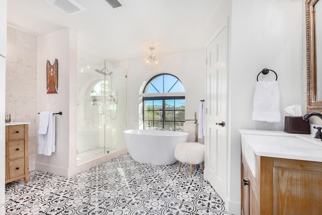 bathroom featuring vanity and separate shower and tub