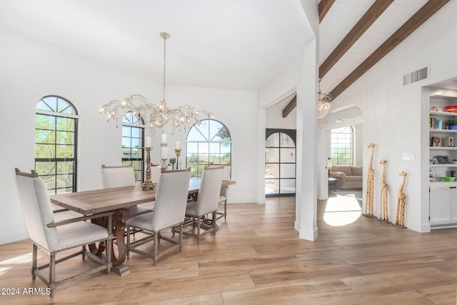 dining area featuring beamed ceiling, high vaulted ceiling, light hardwood / wood-style floors, and a notable chandelier