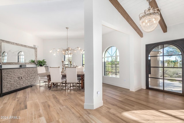 dining space featuring a chandelier, hardwood / wood-style flooring, and a wealth of natural light