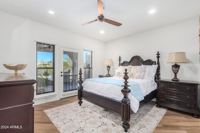 bedroom with access to exterior, ceiling fan, and hardwood / wood-style floors