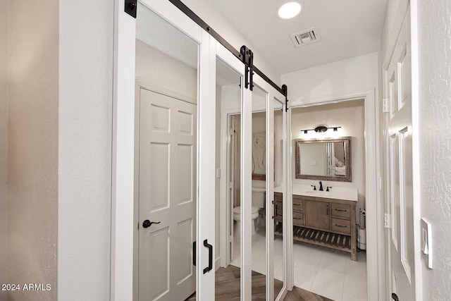 bathroom with vanity and toilet