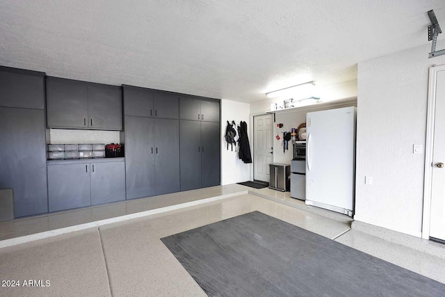 garage featuring white refrigerator