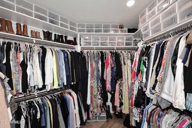 spacious closet featuring hardwood / wood-style floors