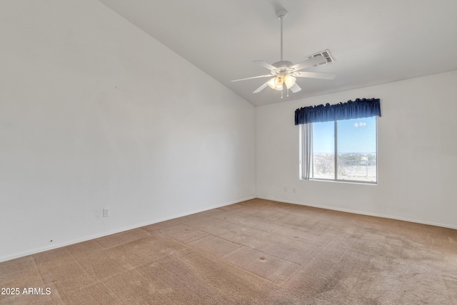 carpeted empty room with lofted ceiling and ceiling fan