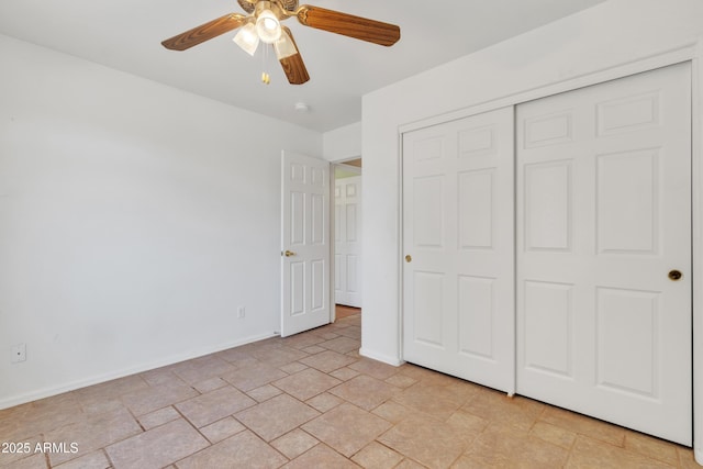 unfurnished bedroom featuring a closet and ceiling fan