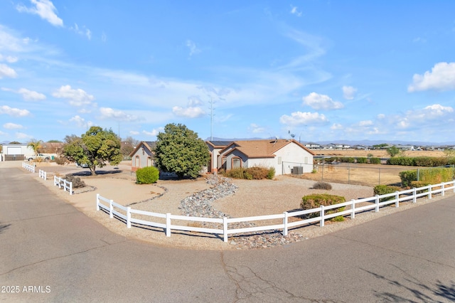 view of front of property with a rural view