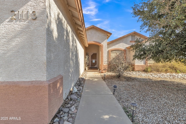 doorway to property with a garage