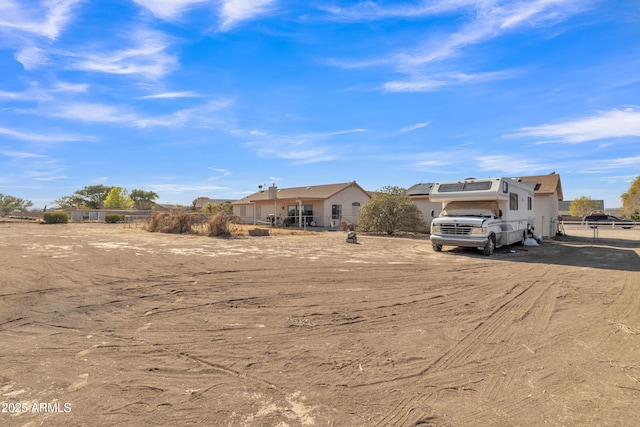 ranch-style home with solar panels