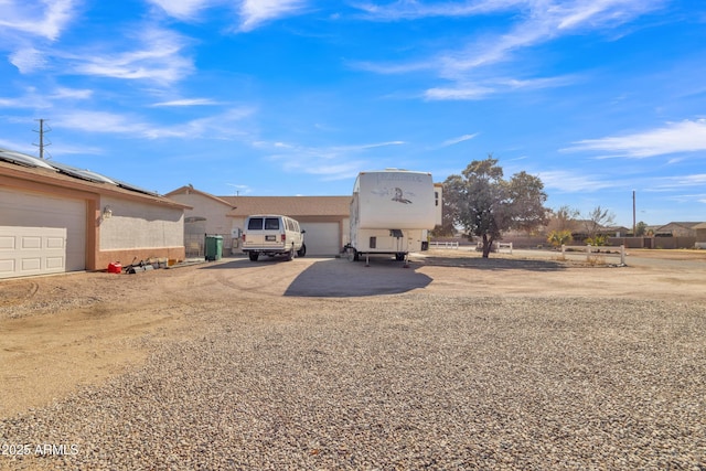 back of property featuring a garage