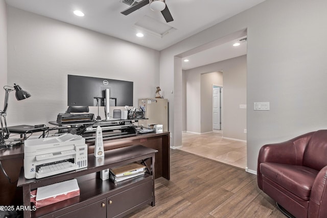 office space featuring baseboards, attic access, recessed lighting, wood finished floors, and a ceiling fan