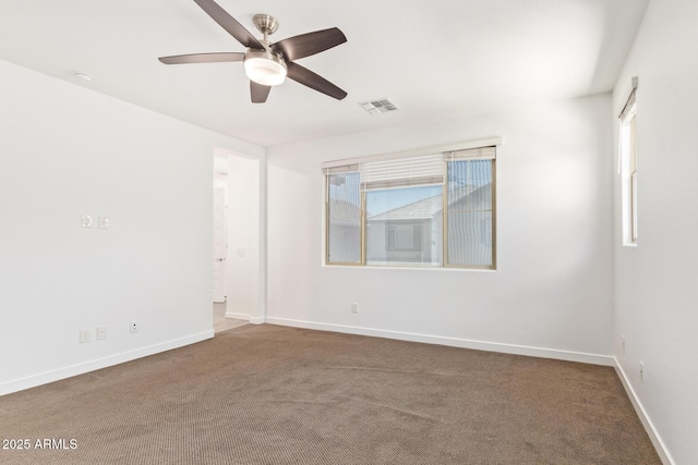 1081 E Armstrong Way, Chandler, AZ 85286 - unfurnished room with a ceiling fan, dark carpet, healthy amount of natural light, and baseboards