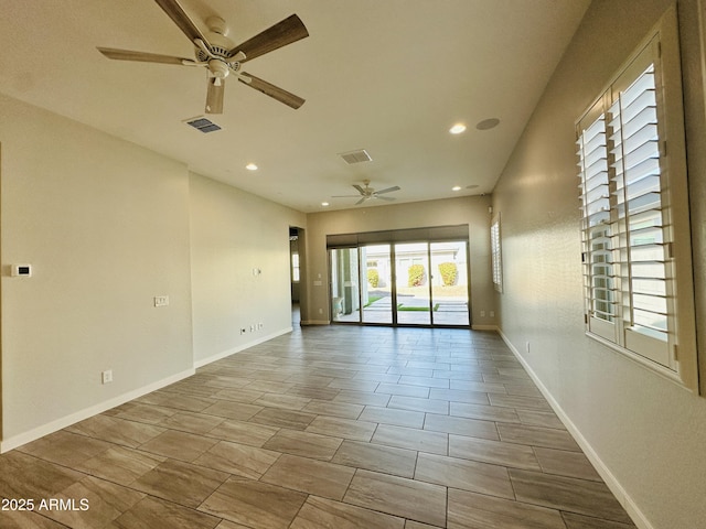 empty room featuring ceiling fan